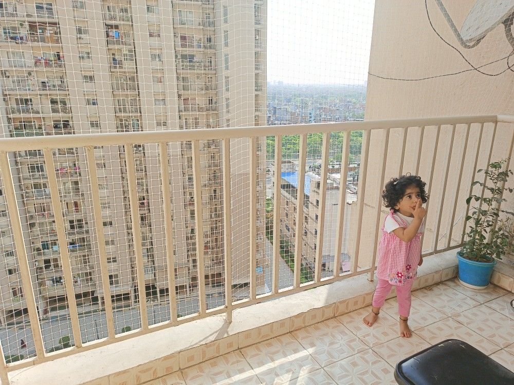 Kids safety nets protecting children from balcony falls in Bangalore by Tharak Enterprises